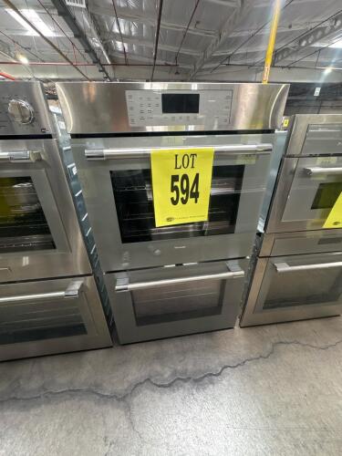 A built-in Thermador ME302YP/03 double wall oven featuring stainless steel finish, advanced convection heating, digital controls, and a large capacity. Manufactured June 2005 in the USA from US and imported parts. Suitable for high-end kitchens requiring 