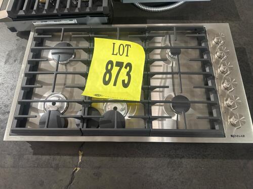 JennAir JGC7636BS 36" Gas Cooktop with 6 burners, including an 18,000 BTU Dual-Stacked PowerBurner, 15,000 BTU Brass Burner, 9,000 BTU Brass Burner, 6,000 BTU Brass Simmer Burner, and two 12,000 BTU Burners. Features stainless steel surface, Single Point 