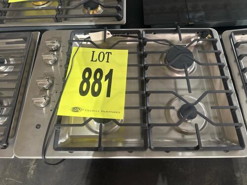 GE JGP3030SL1SS 30" Stainless Steel Gas Cooktop featuring 4 sealed burners, including a 15,000 BTU Power Boil burner and a 5,000 BTU Precise Simmer burner, electronic ignition, cast iron grates, and a deep recessed cooktop for spill containment. Serial Nu