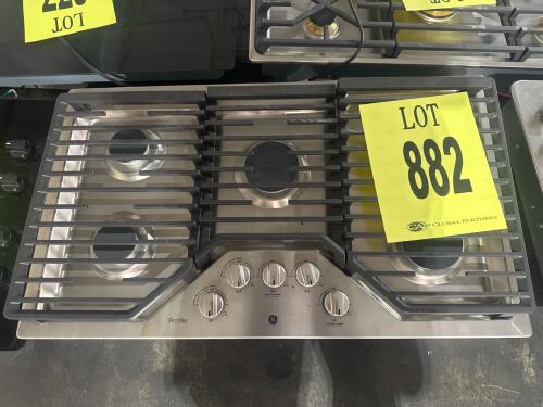 GE Profile Model PGP7036SL1SS, 36" stainless gas cooktop with 5 burners, including an 18,000 BTU center tri-ring burner. Features edge-to-edge continuous grates, electronic ignition, front-mounted control knobs. , serial SH714618Q. Ce