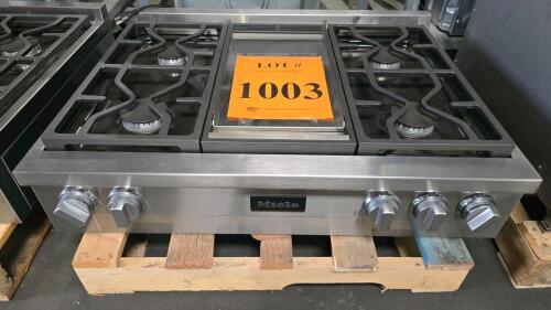 Miele KMR 1136-3 G GD 36-Inch 6-Burner Gas Rangetop, featuring stainless steel finish, natural gas and LP compatibility, automatic electronic ignition, front control knobs, cast iron grates, 12,500 BTU simmer burner, two 19,500 BTU high power burners, 13,
