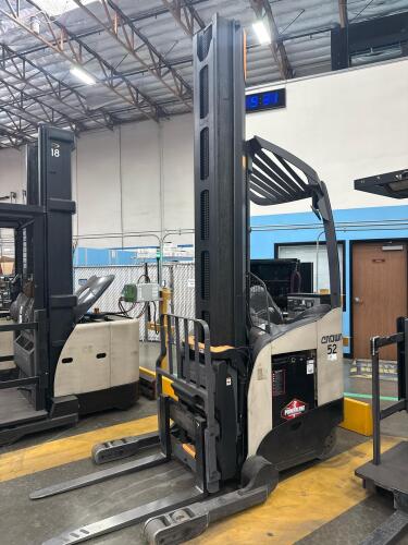 2017 CROWN RM6025-45 ELECTRIC STAND-UP REACH TRUCK WITH SIDE SHIFTER, 4,500 LBS CAPACITY, 36 VOLTS, 42&rdquo; FORKS, APPROX. MAST LOWERED: 140&rdquo;, HOURS: 12,165, SERIAL: 1A493658, UNIT #52 (GROUND LEVEL REMOVAL ONLY)