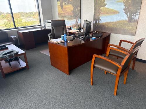 Matching executive office furniture suite including U-Shape Desk (approx. 72&rdquo; x 126&rdquo; , two guest chairs, leather couch and armchair, credenza, coffee table, and chair, cherry/mahogany wood finish, dark brown upholstery, (FURNITURE ONLY), (LOCATION: 3RD F