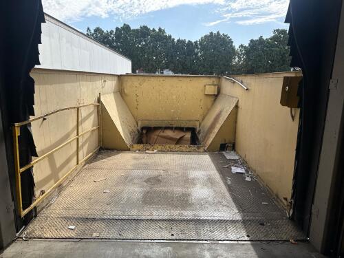 Industrial Stationary Trash Compactor, Approx. 64" x 60" Chamber ((DELAY PICKUP MID-OCTOBER) Bolted to the ground and welded to loading dock), (BUYER NEEDS TO CUT BOLTS and un- welded)