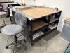 INDUSTRIAL METAL WORK TABLE WITH STAINLESS STEEL TOP, 60&rdquo; x 36&rdquo;, and stool, LOCATION: IN WAREHOUSE NEXT TO MTEX PRINTER