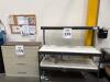 METAL FRAME WORK BENCH WITH 3-DRAWER LATERAL FILE, BENCH IS 5&rsquo;FT LONG, LOCATION: IN WAREHOUSE NEXT TO MTEX PRINTER