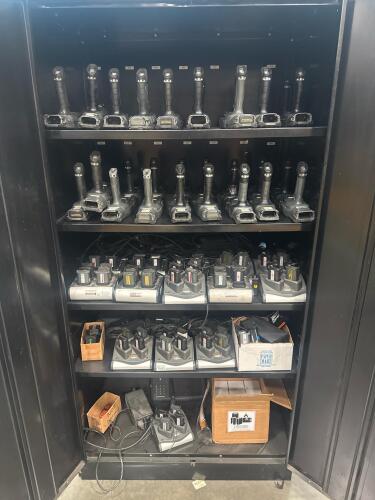 LOT (29) Handheld Mobile Barcode Scanners with Charging Docks and storage cabinet