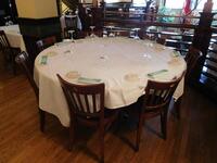 (SIZE: 5.5 FT) DIAMETER BANQUEST TABLE W/ 8 WOODEN CHAIRS - (LOCATION: 2ND FLOOR MAIN DINING AREA)