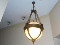 LARGE HANGING DOME LAMP W/ BRASS CHAIN & MOUNT - (LOCATION: TOP OF 1ST FLOOR FRONT STAIRCASE - BETWEEN 1ST FLOOR AND 2ND)