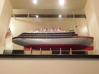 RED / WHITE SHIP PROP "MRS WOLLENSKY" (44" LENGTH X 31" TALL X 6" WIDTH) - (LOCATION: TOP OF 1ST FLOOR FRONT STAIRCASE - BETWEEN 1ST FLOOR AND 2ND)