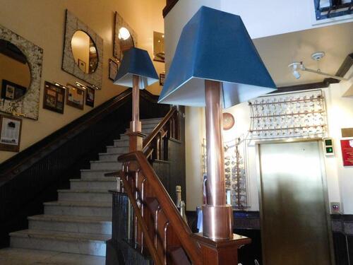 (2) COPPER BASE LAMPS (16" WIDTH X 39" TALL) - (LOCATION: 1ST FLOOR STAIRCASE RAILING NEAR ENTRANCE)