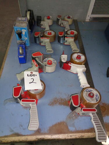 assorted tape dispensers, stamps etc.