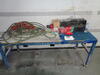 Steel framed portable work bench, air hose and sundries