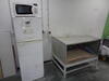 Fridge, microwave oven and steel bench