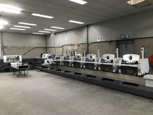 (2006) Heidelberg ST-350 Stitchmaster w/ 5 Vertical feeders (TAS350), 1 Horizontal Feeder (TAL350) 2-Head continuous stitcher, 3-Knife trimmer w/ take-off conveyer (TR350), Cover feeder (UFA350), Associated 3-phase electric motor and switch and equipment,