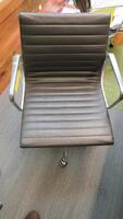 HERMAN MILLER "EAMES" ALUMINUM GROUP MANAGEMENT GROUP CHAIR, MANUAL LIFT WITH CASTERS AND ARMS, CARPET CASTERS WITH CHROME HOOD, POLISHED ALUMINUM BASE AND FRAME, BLACK MLC LEATHER. MSRP $2000