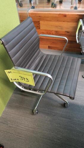 HERMAN MILLER "EAMES" ALUMINUM GROUP MANAGEMENT GROUP CHAIR, MANUAL LIFT WITH CASTERS AND ARMS, CARPET CASTERS WITH CHROME HOOD, POLISHED ALUMINUM BASE AND FRAME, BLACK MLC LEATHER. MSRP $2000