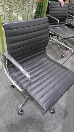 HERMAN MILLER "EAMES" ALUMINUM GROUP MANAGEMENT GROUP CHAIR, MANUAL LIFT WITH CASTERS AND ARMS, CARPET CASTERS WITH CHROME HOOD, POLISHED ALUMINUM BASE AND FRAME, BLACK MLC LEATHER. MSRP $2000
