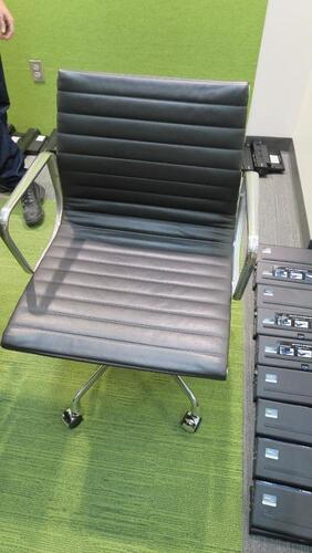 HERMAN MILLER "EAMES" ALUMINUM GROUP MANAGEMENT GROUP CHAIR, MANUAL LIFT WITH CASTERS AND ARMS, CARPET CASTERS WITH CHROME HOOD, POLISHED ALUMINUM BASE AND FRAME, BLACK MLC LEATHER. MSRP $2000