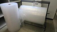 ULINE BUBBLE WRAP DISPENSER, PLUS EXTRA ROLL OF BUBBLE WRAP.