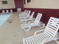 (16) GROSFILLEX LOUNGERS WITH (20) GROSFILLEX SIDE TABLES (IN-DOOR POOL)