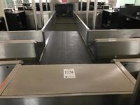 Double baggage belt for check-in desk island of eight desks. Total length 7500mm. Collection belt L 4850mm. Feeder belt L 2600mm.