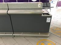 Left side security information desk. Stainless steel frontage and kick bar. Lockable cupboard and storage shelf. Width 1200mm, depth 900mm, height 1200mm.