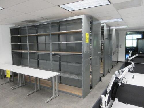 SLIDING TRACKED STORAGE SYSTEM ON RAILS W/ (5) ROLLING SHELVES 12' X 3' X 8' AND (2) FIXED RACKS 12' X 19" X 8', 22' LONG, (2ND FLOOR)