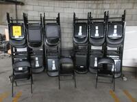 LOT (100) MECO BLACK VINYL FOLDING CHAIRS WITH (2) ROLLING CARTS, (2P PARKING LOT)