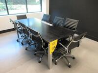 STEELCASE WOOD BLACK CONFERENCE TABLE W/ POWER DISTRIBUTION UNIT 7' X 3' X 29" W/ (8) BLACK AND CHROME CHAIRS AND WOOD CREDENZA 6' X 2' X 23" (1ST FLOOR)