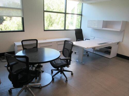 STEELCASE WOOD WHITE DESK L - SHAPE DESK W/ LEFT RETURN AND POWER DISTRIBUTION UNIT AND CHAIR 90" X 72" W/ OVERHEAD CABINET, CREDENZA 9' X 2' X 23", STEELCASE 32" BLACK TOP ROUND TABLE W/ (3) BLACK OFFICE CHAIRS, AND STEELCASE 3 DOOR LATERAL, (2ND FLOOR)