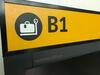 Check-in desk 'B1' sign and monitor - 4