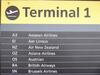 Airline information board, mounted on a acrylic sheet, showing last airlines to use T1. (tombstone holder not included in sale)