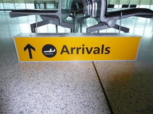 Illuminated 'Arrivals' ceiling mounted sign